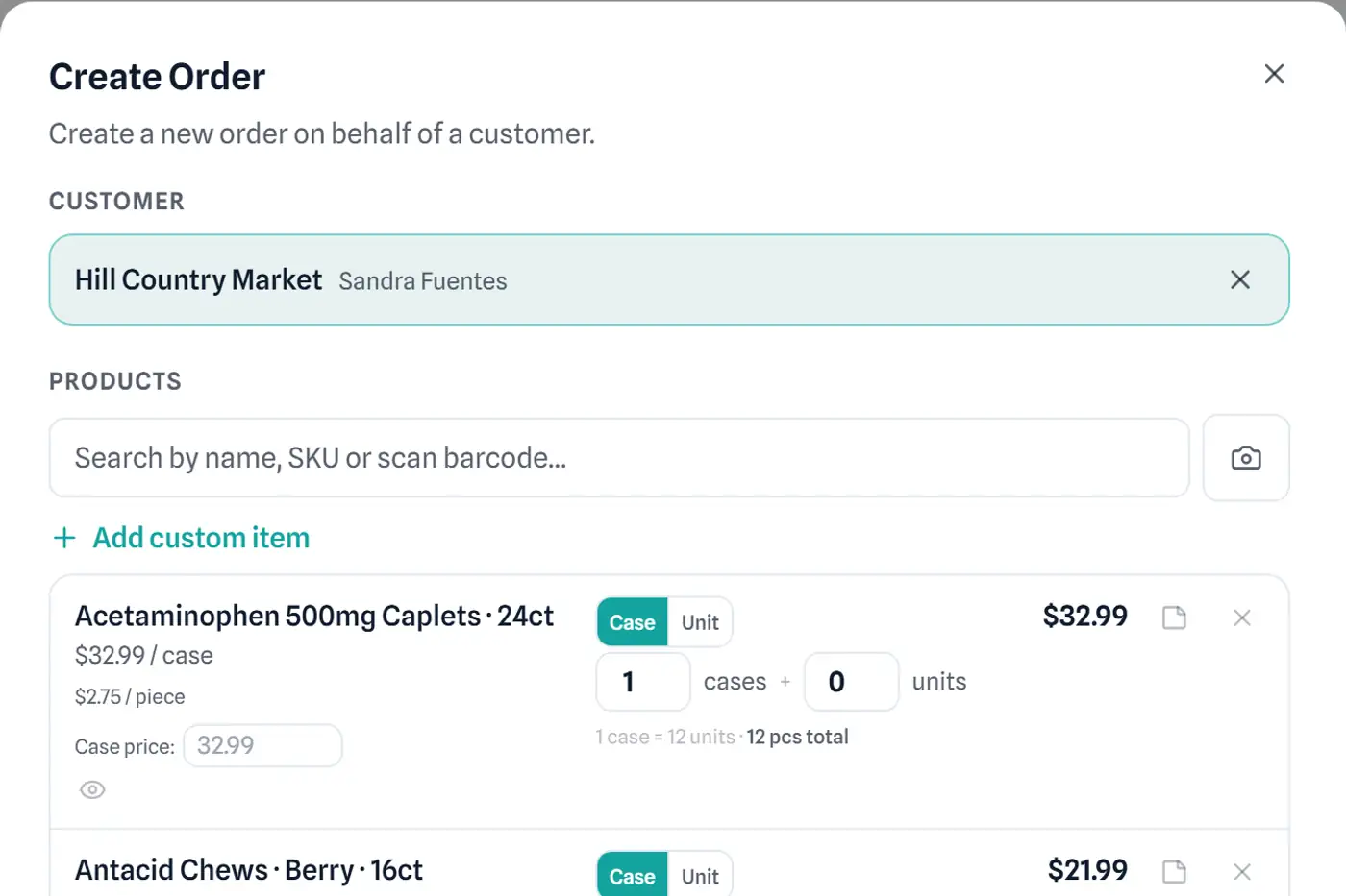 RouteFlow order builder showing a wholesale order being priced line by line, with live subtotal and total.